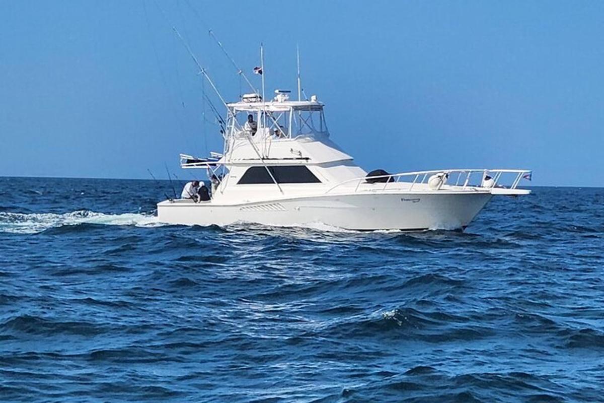 a white boat in the middle of the ocean
