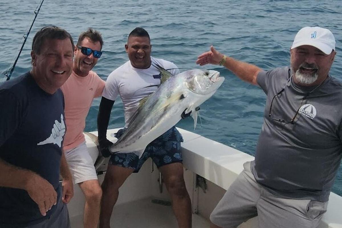 a group of men on a boat with a large fish