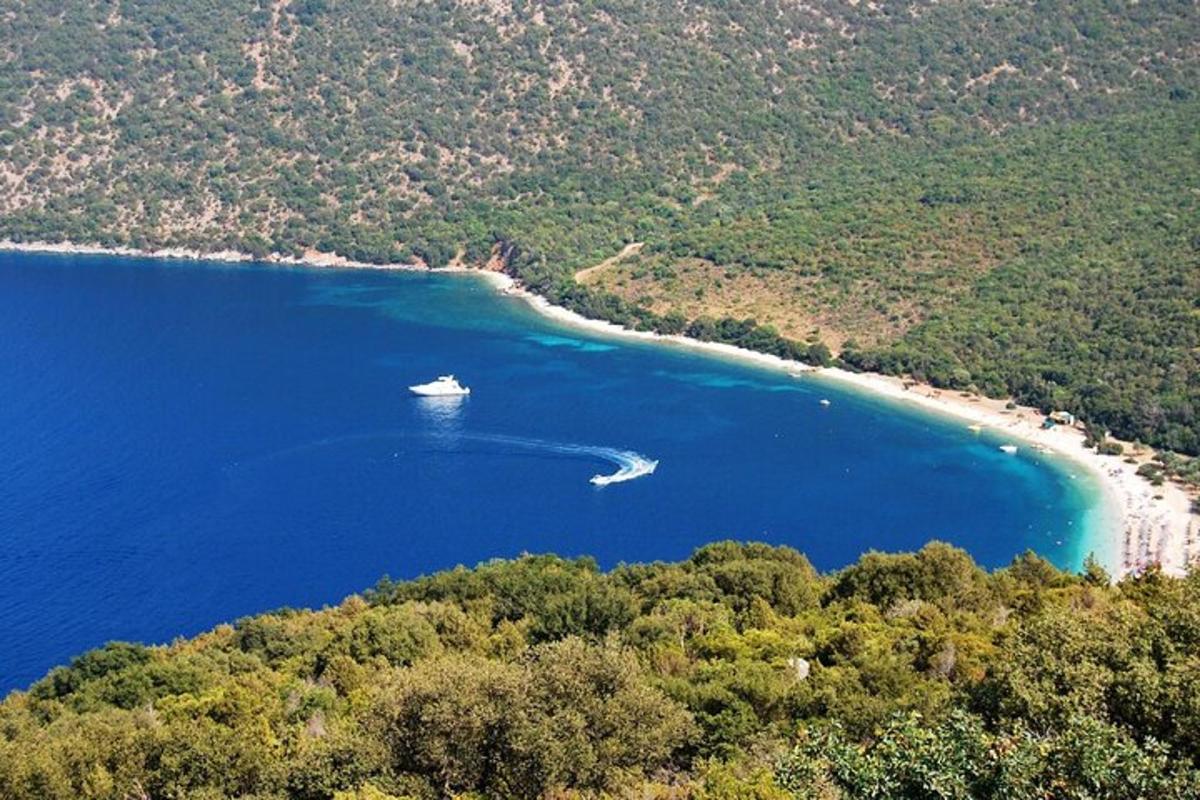 an aerial view of a boat in a large body of water