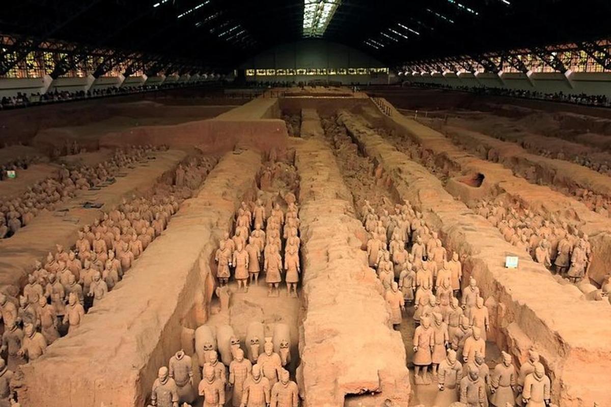 a group of people standing in a large arena