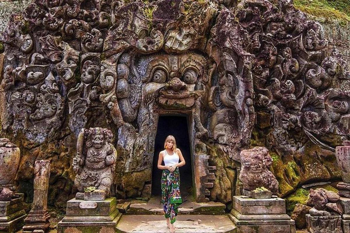 a woman standing in the doorway of a temple