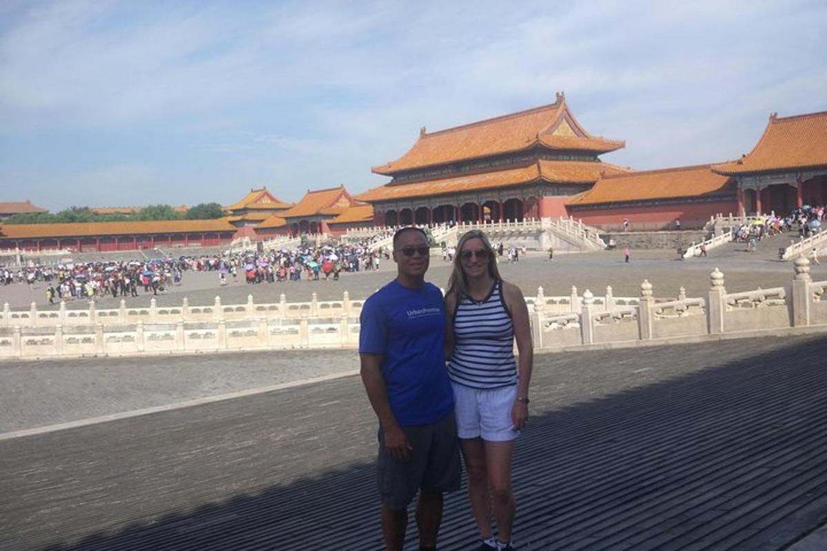 a man and a woman standing in front of a building