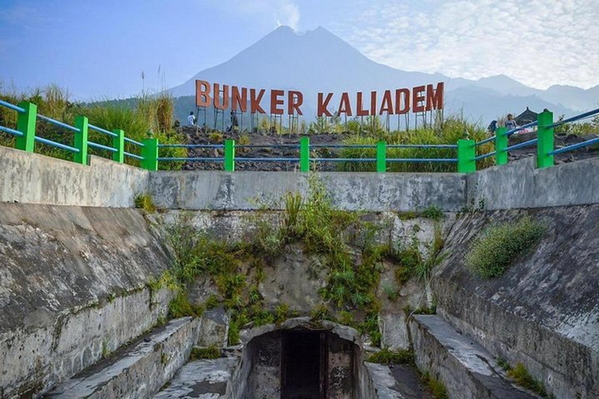 a bridge with a tunnel with a mountain in the background