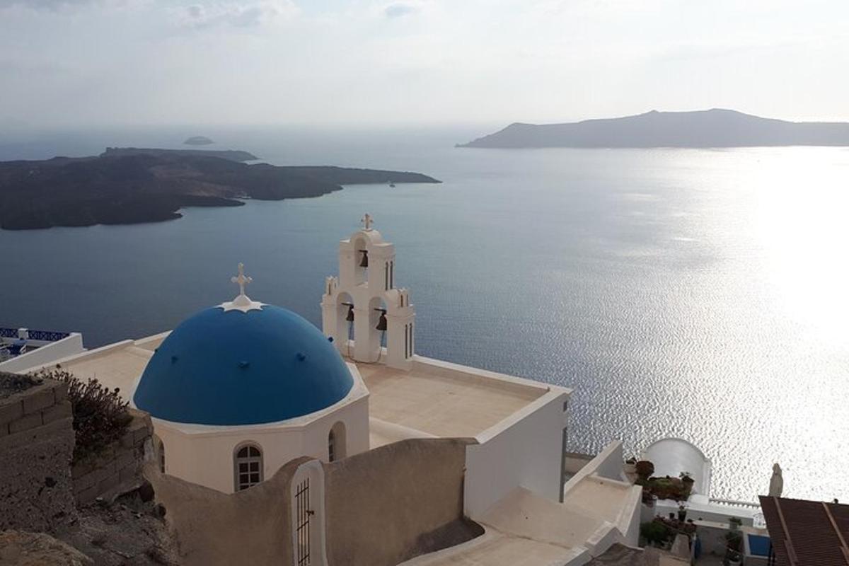 a church with a blue dome on top of the water