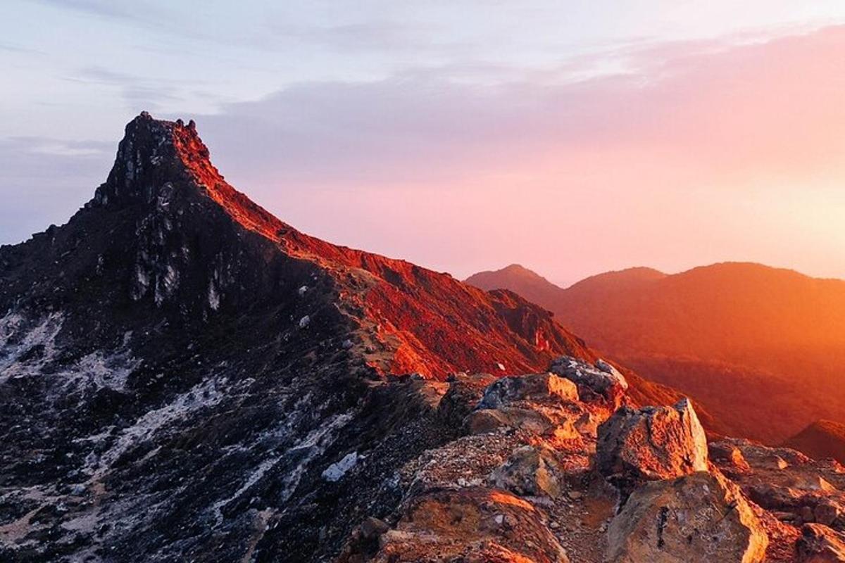 a mountain with the sun setting on it