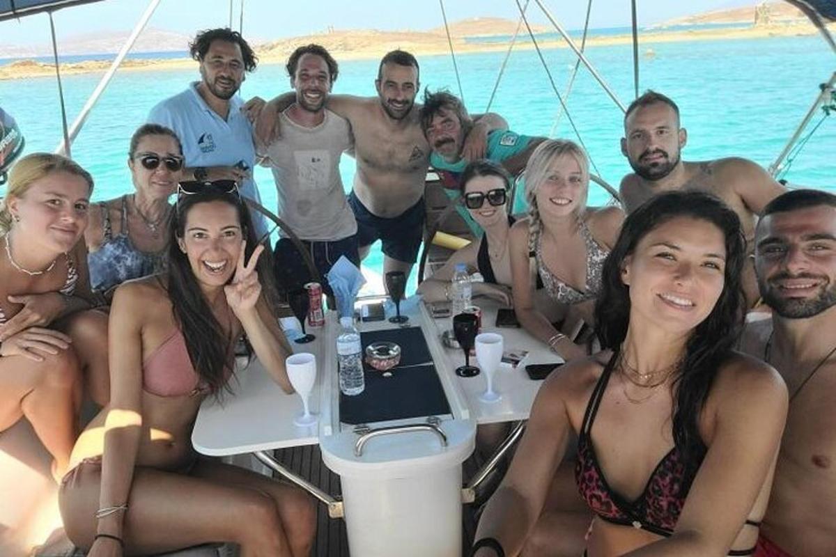 a group of people posing for a picture on a boat