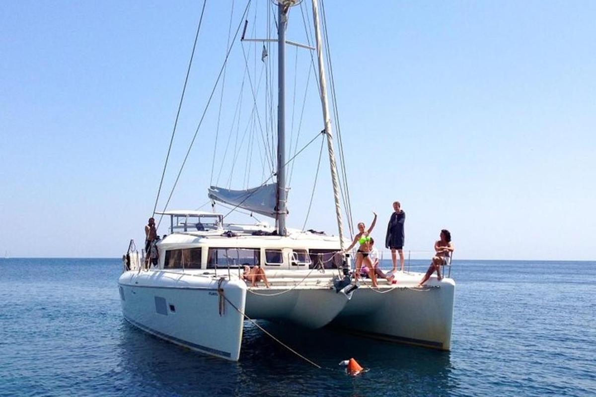 a group of people on a boat in the water