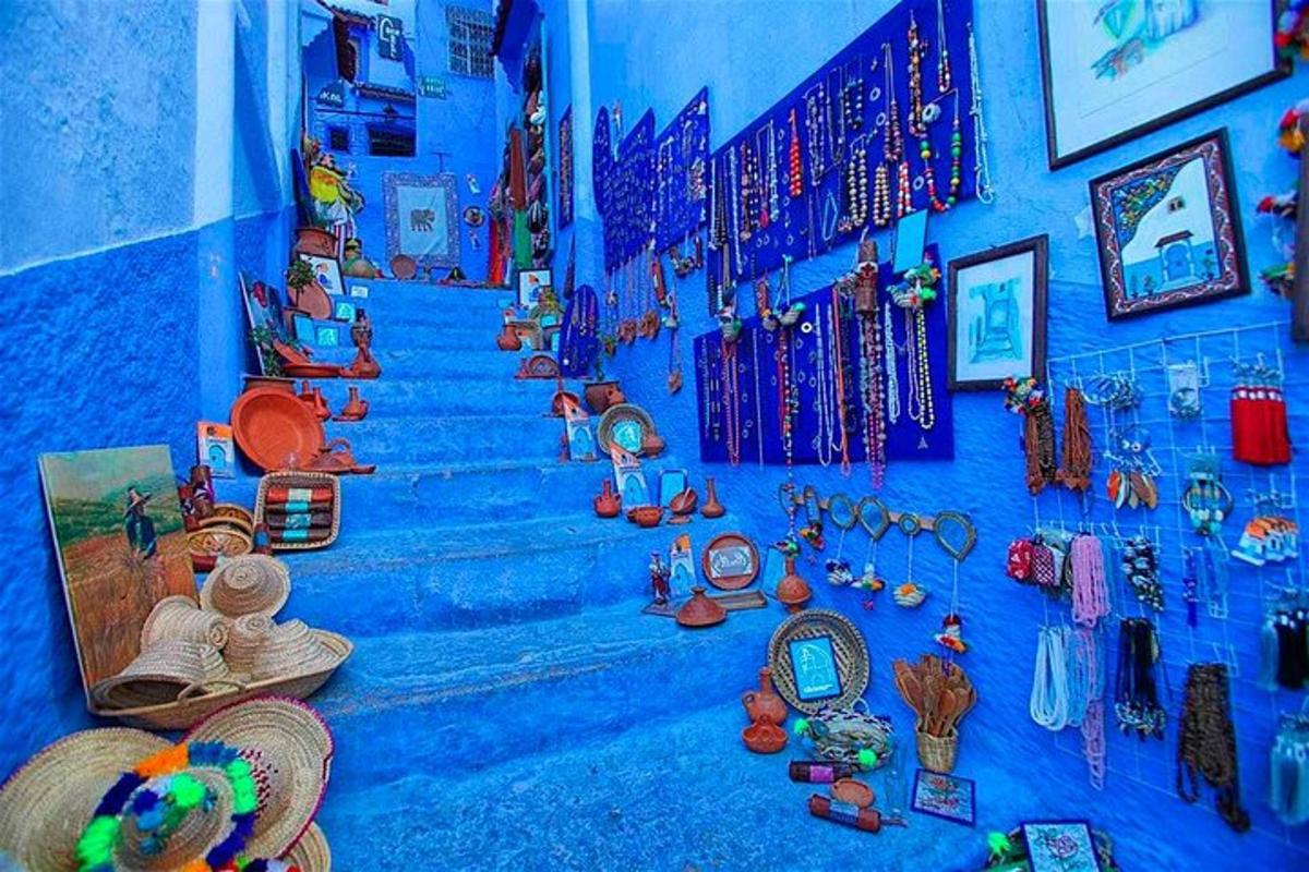 a blue wall with a bunch of items on the stairs