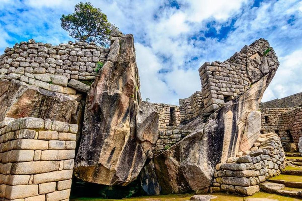 a stone wall with a large rock