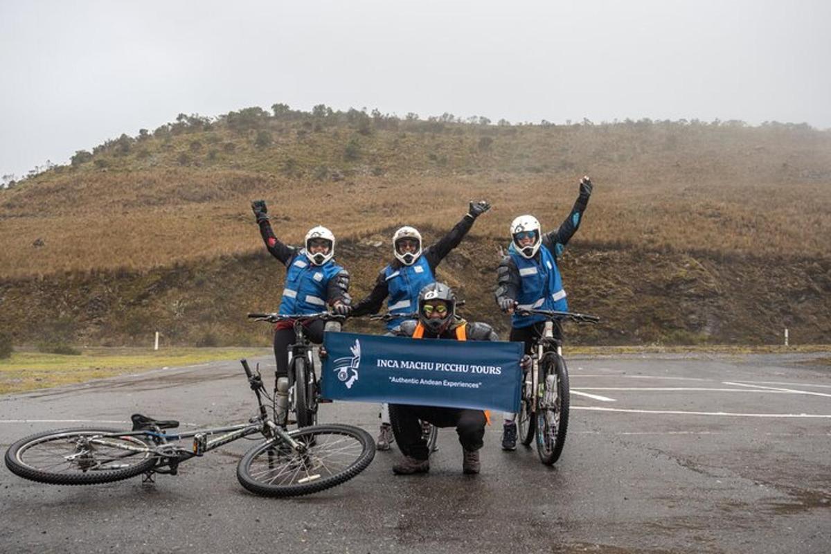 a group of people on their bikes on a road