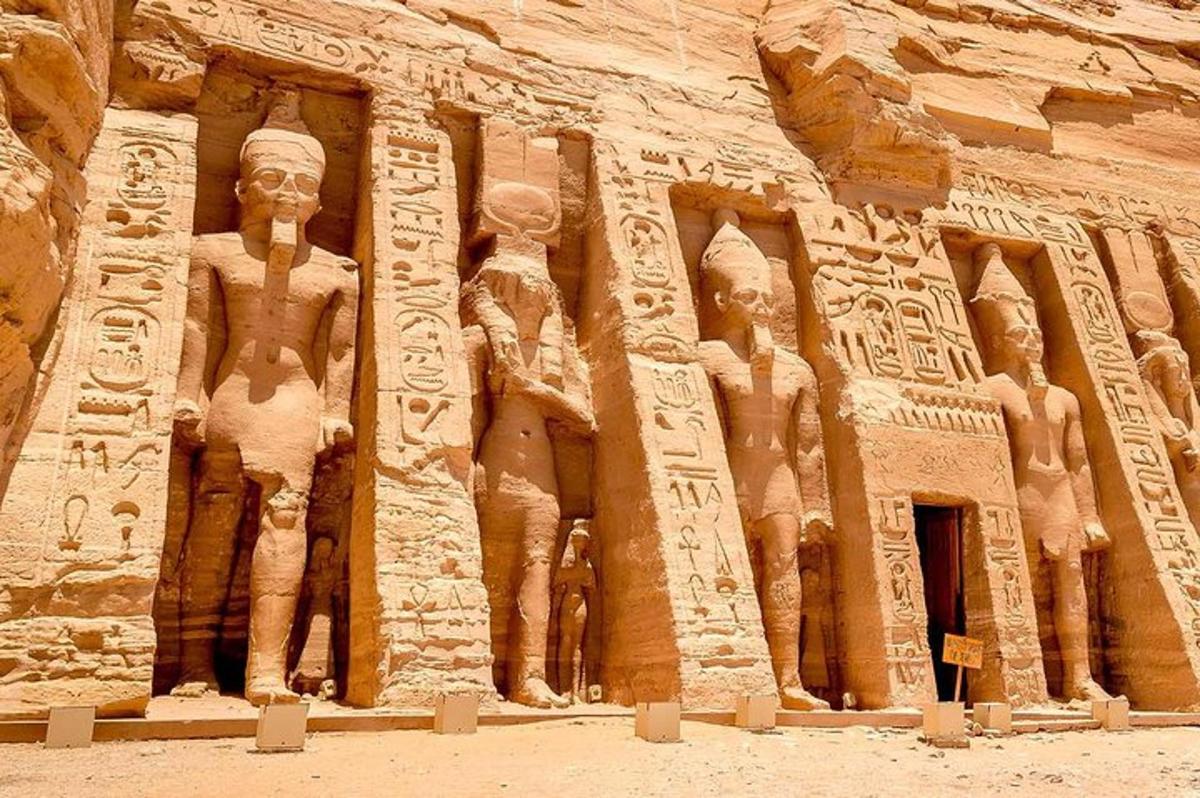 a stone building with statues on the side of it