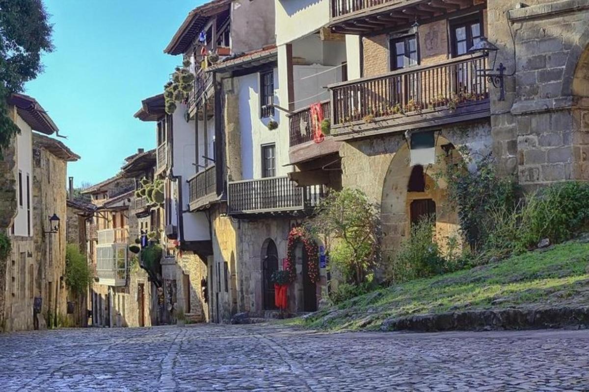 a cobblestone street in a town with buildings