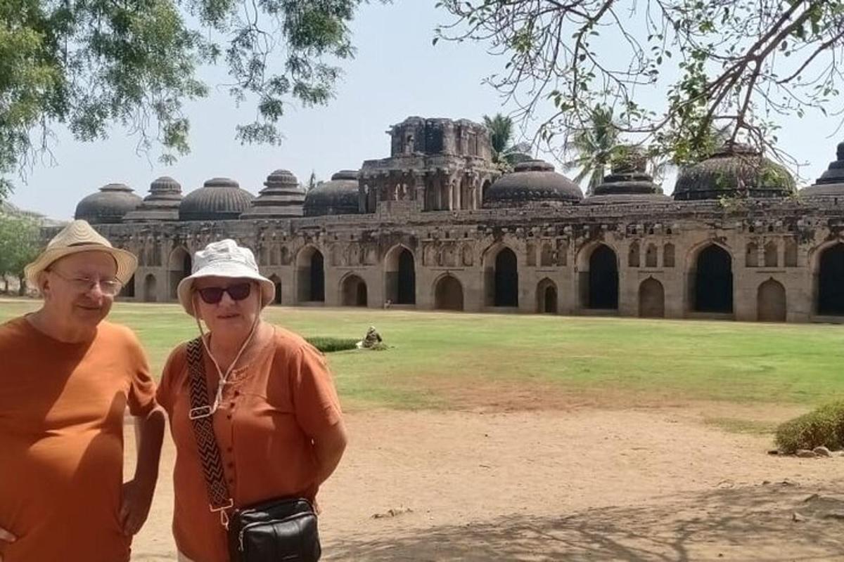 a man and a woman standing in front of a building
