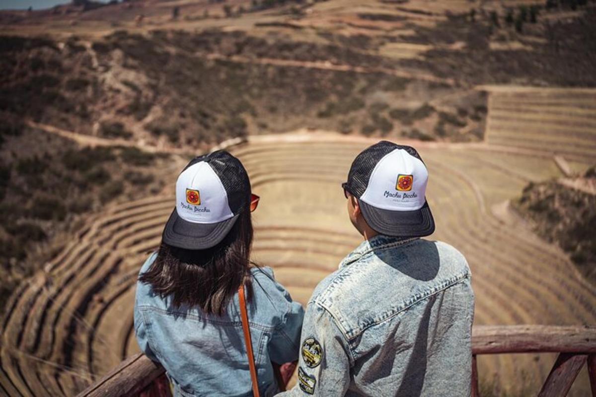 two people are looking at a view of a mountain