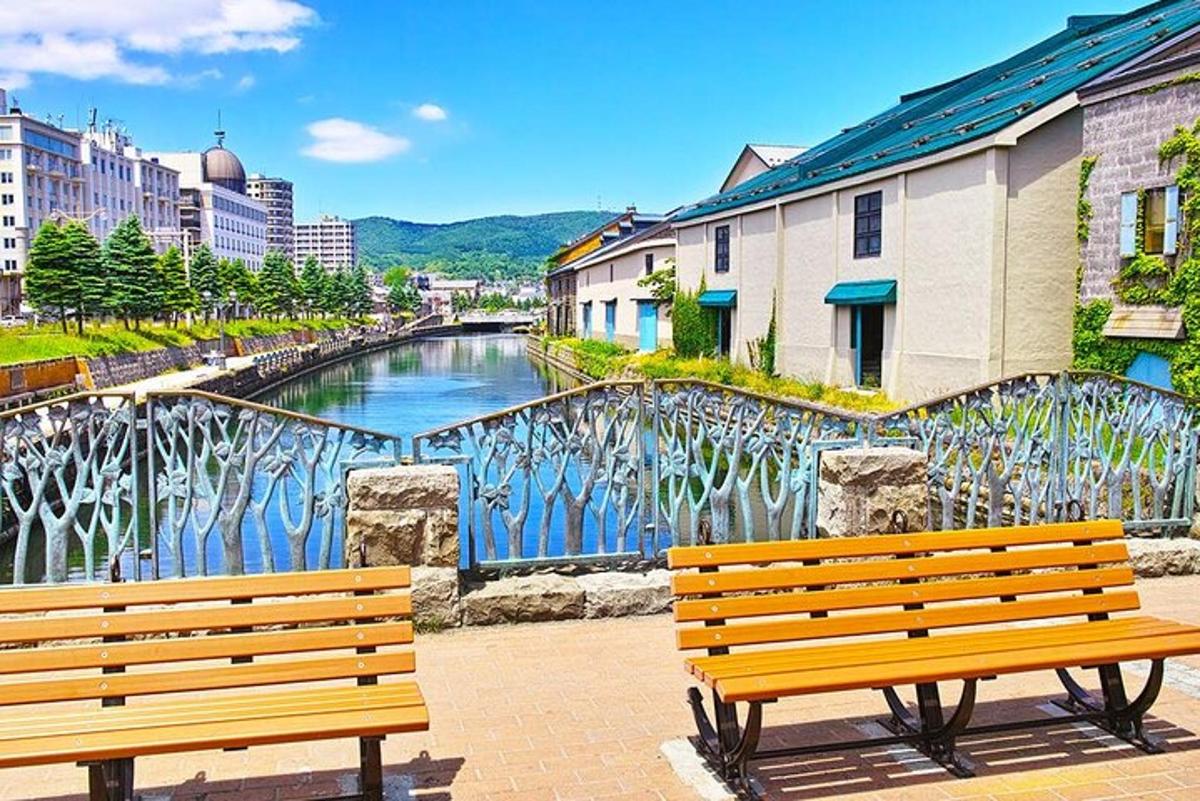 two benches in front of a mural of a river