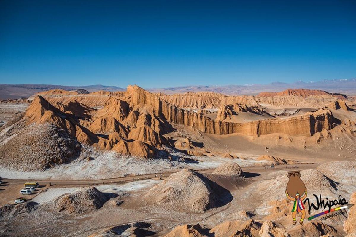 a view of a desert with rocks and mountains