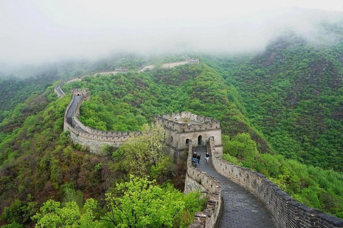 a view of the great wall of china on a mountain