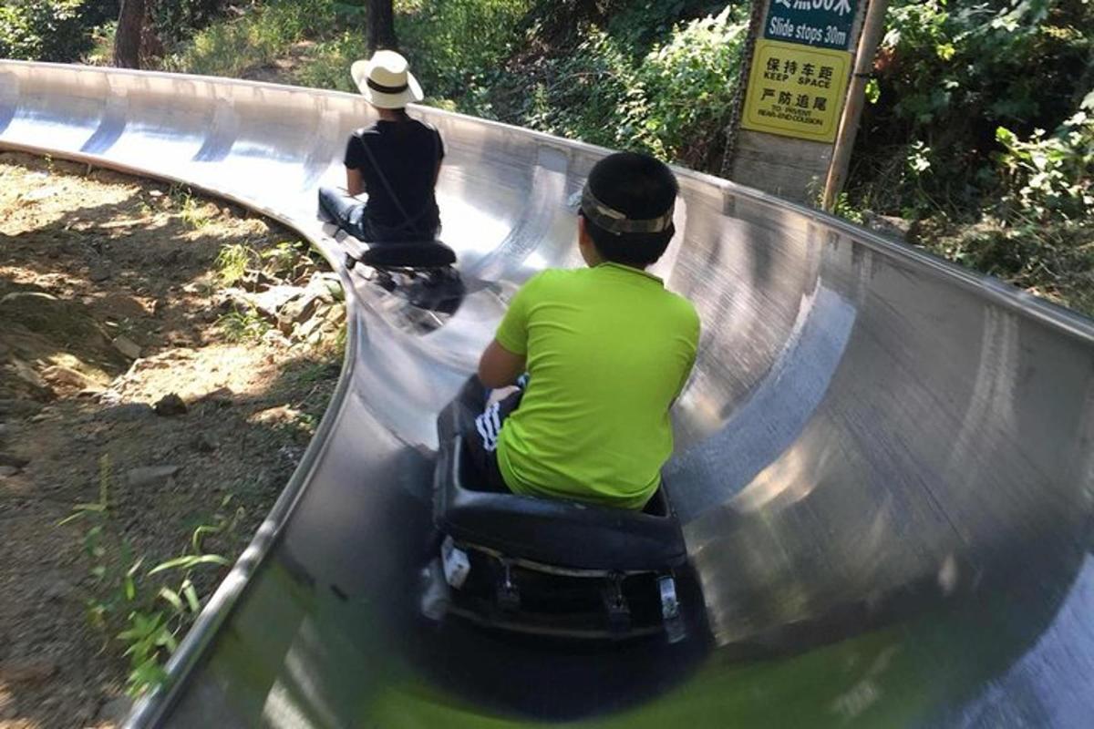 two people riding on a roller coaster
