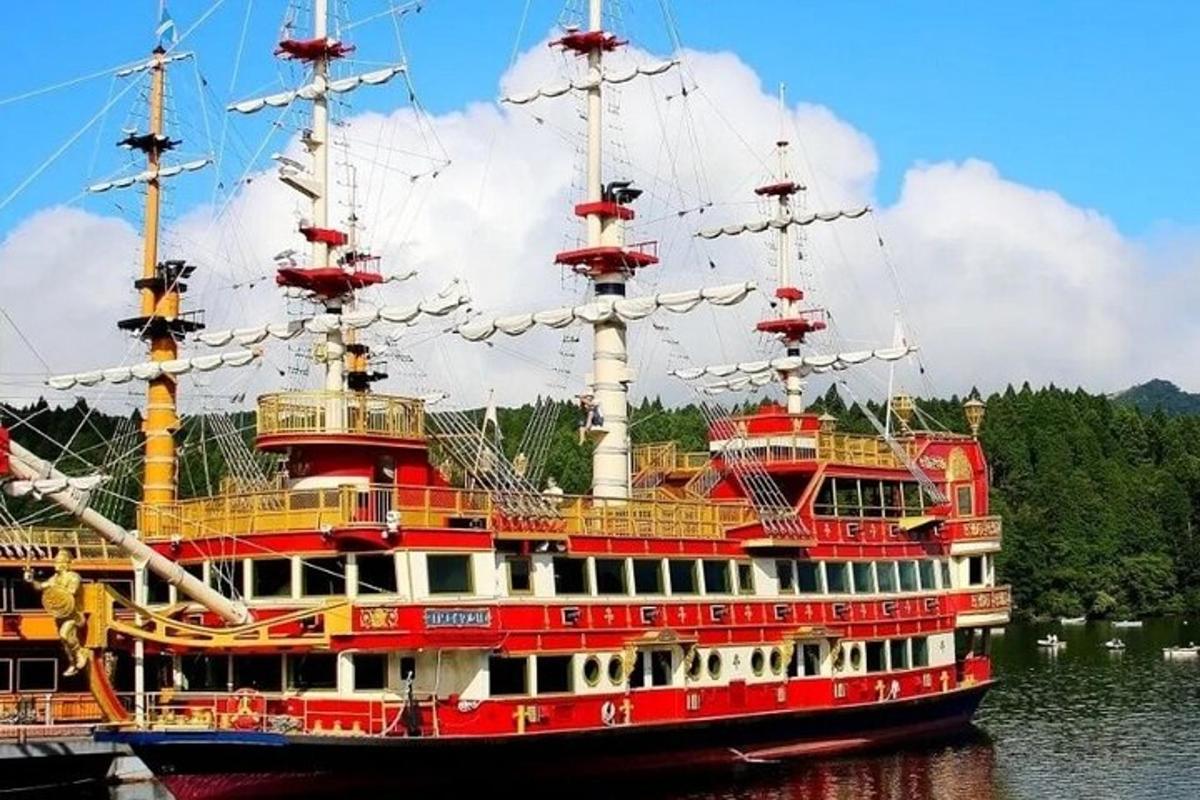 a large red and white boat in the water