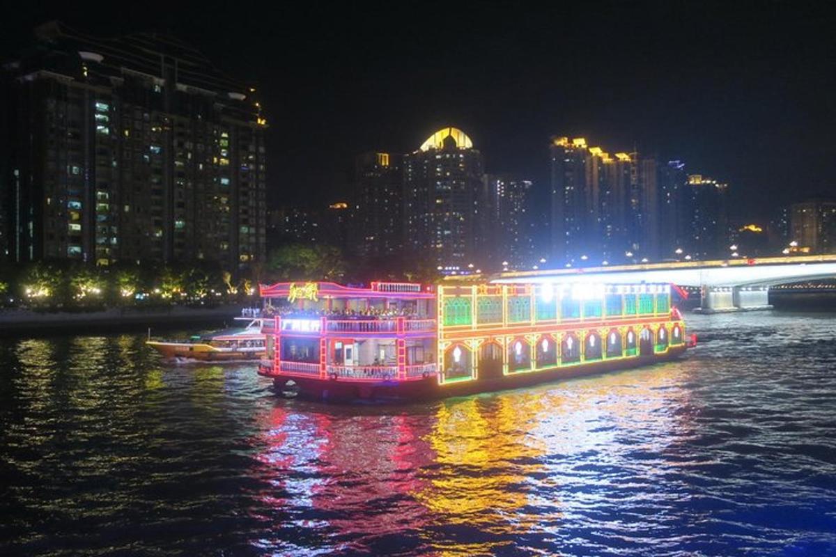 a lit up boat on the water at night