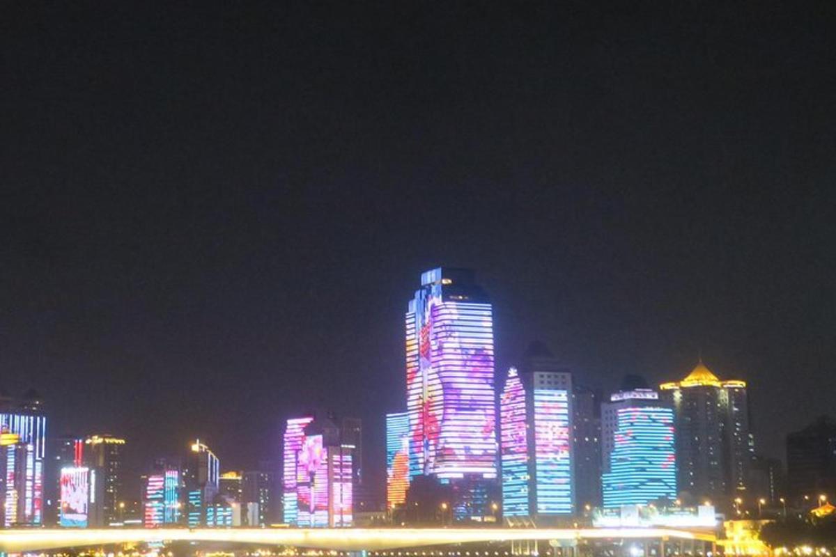 a lit up city skyline at night with