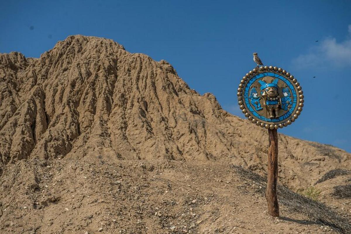 a sign in front of a rocky mountain