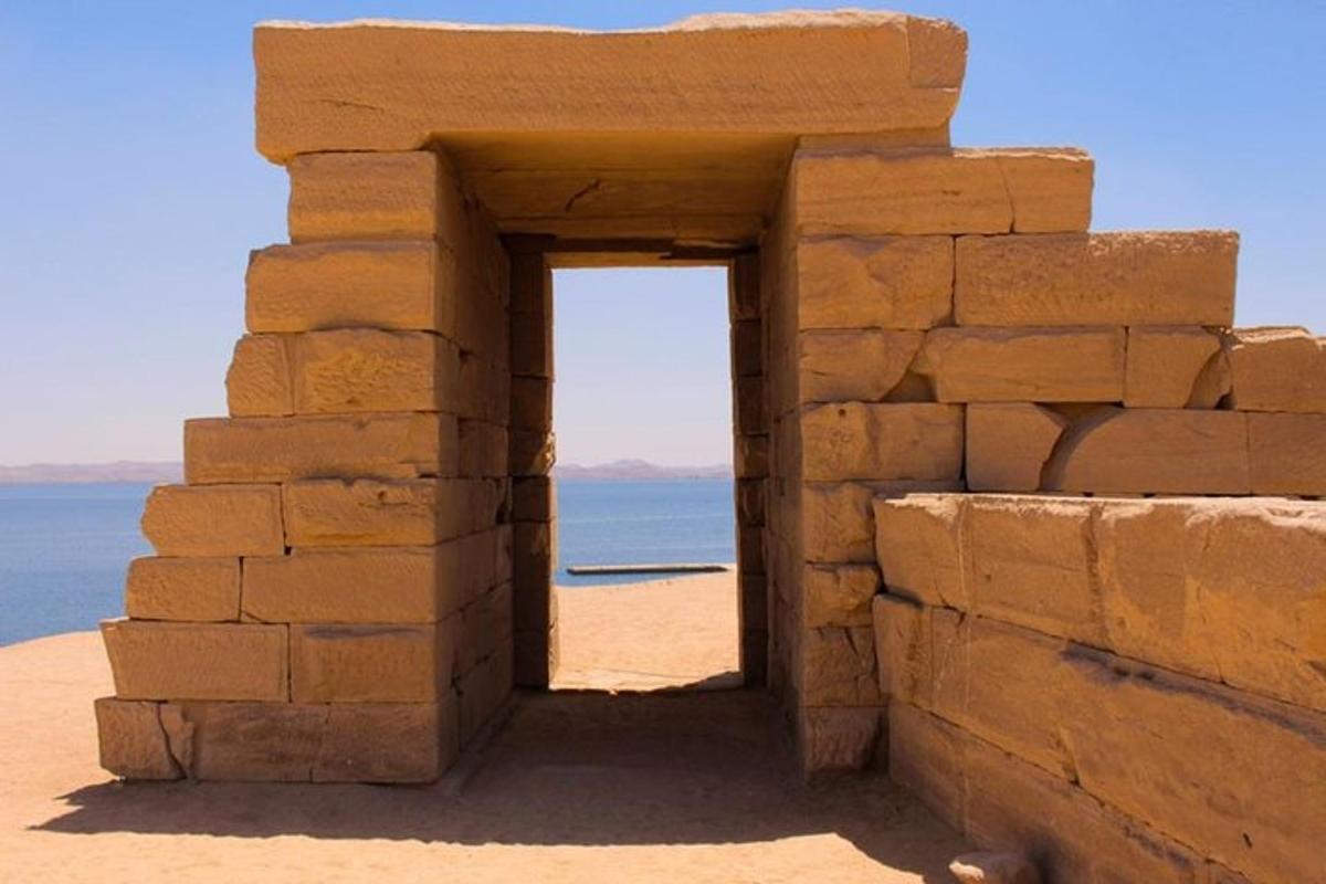 an entrance to a brick building in the desert
