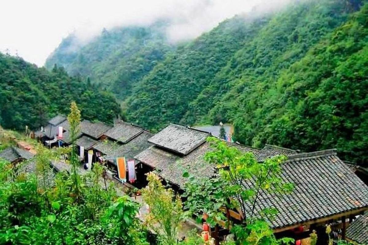 a group of houses on top of a mountain
