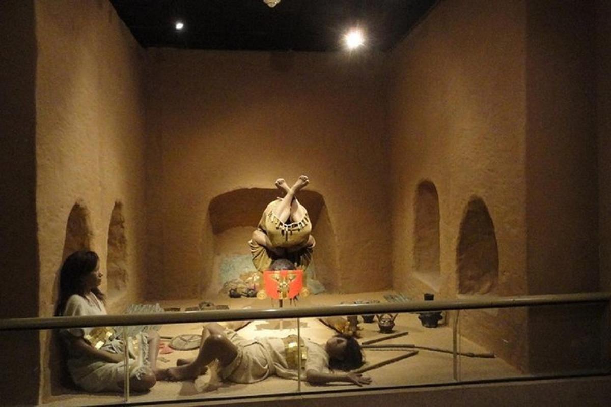 a museum room with a statue of a woman on display