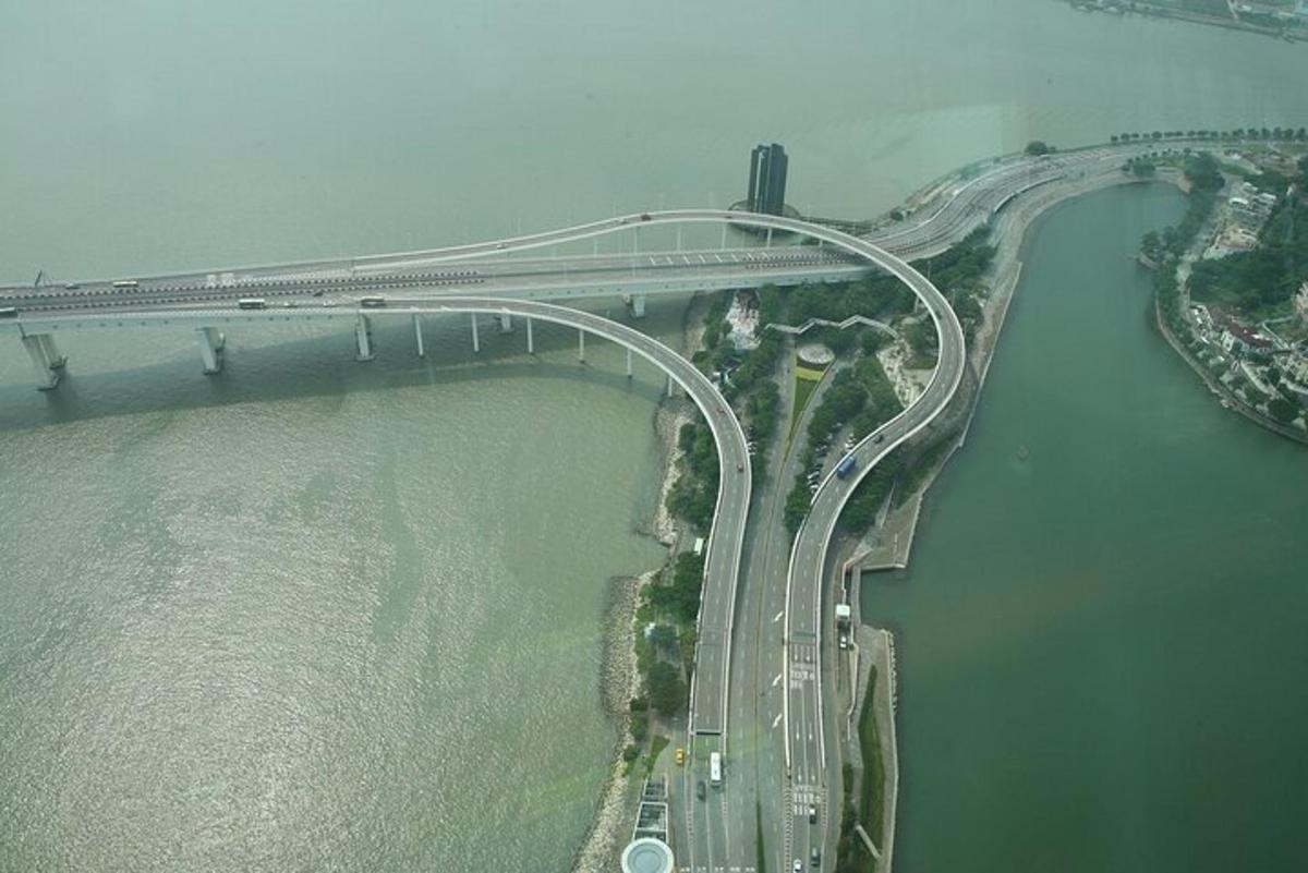 an aerial view of a bridge over the water