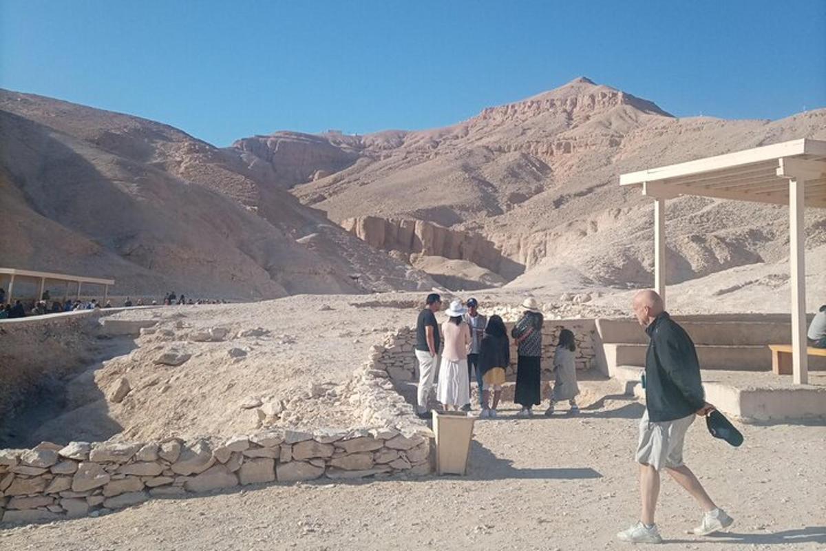 a group of people standing around in the mountains