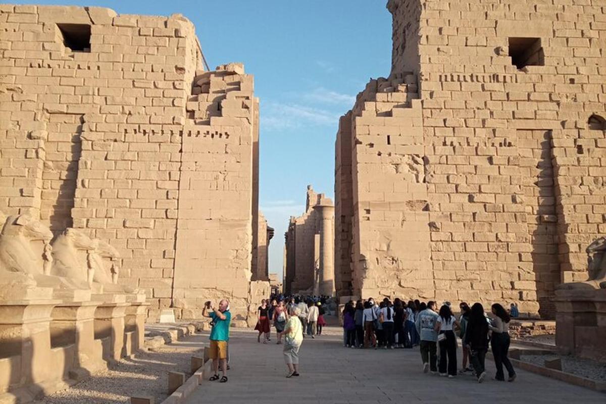 a group of people standing in front of ruins