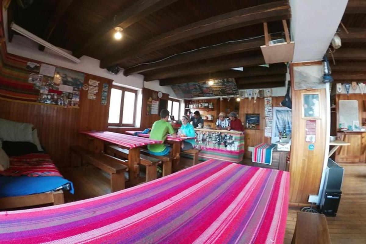 a train room with a table and a bar