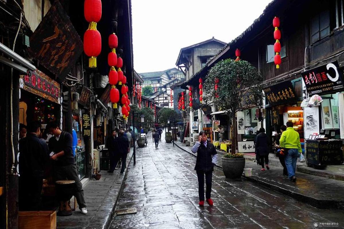 a woman standing on a street in an asian city