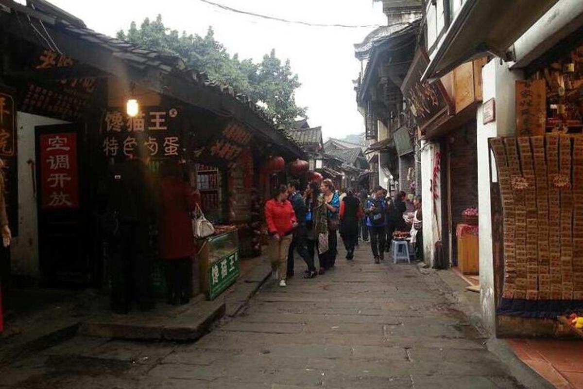 a group of people walking down a street