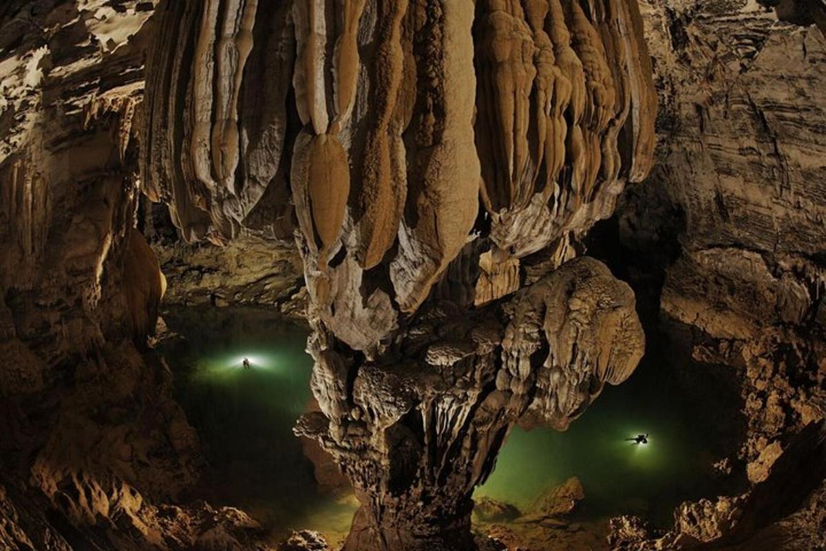 a cave with green lights inside of it