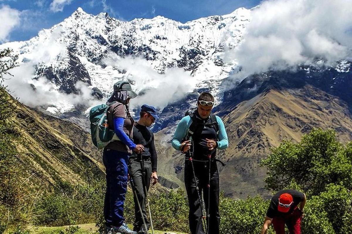 a group of people standing on top of a mountain