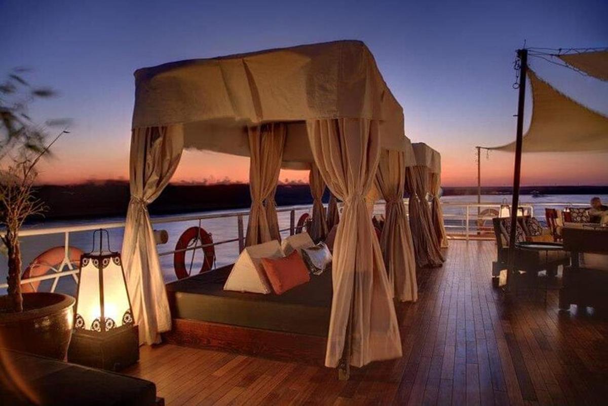 a bed on the deck of a boat