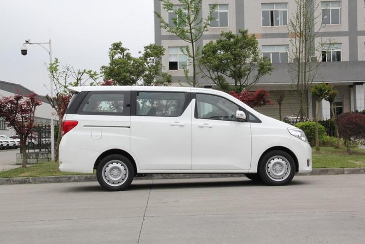 a white small car parked in a parking lot