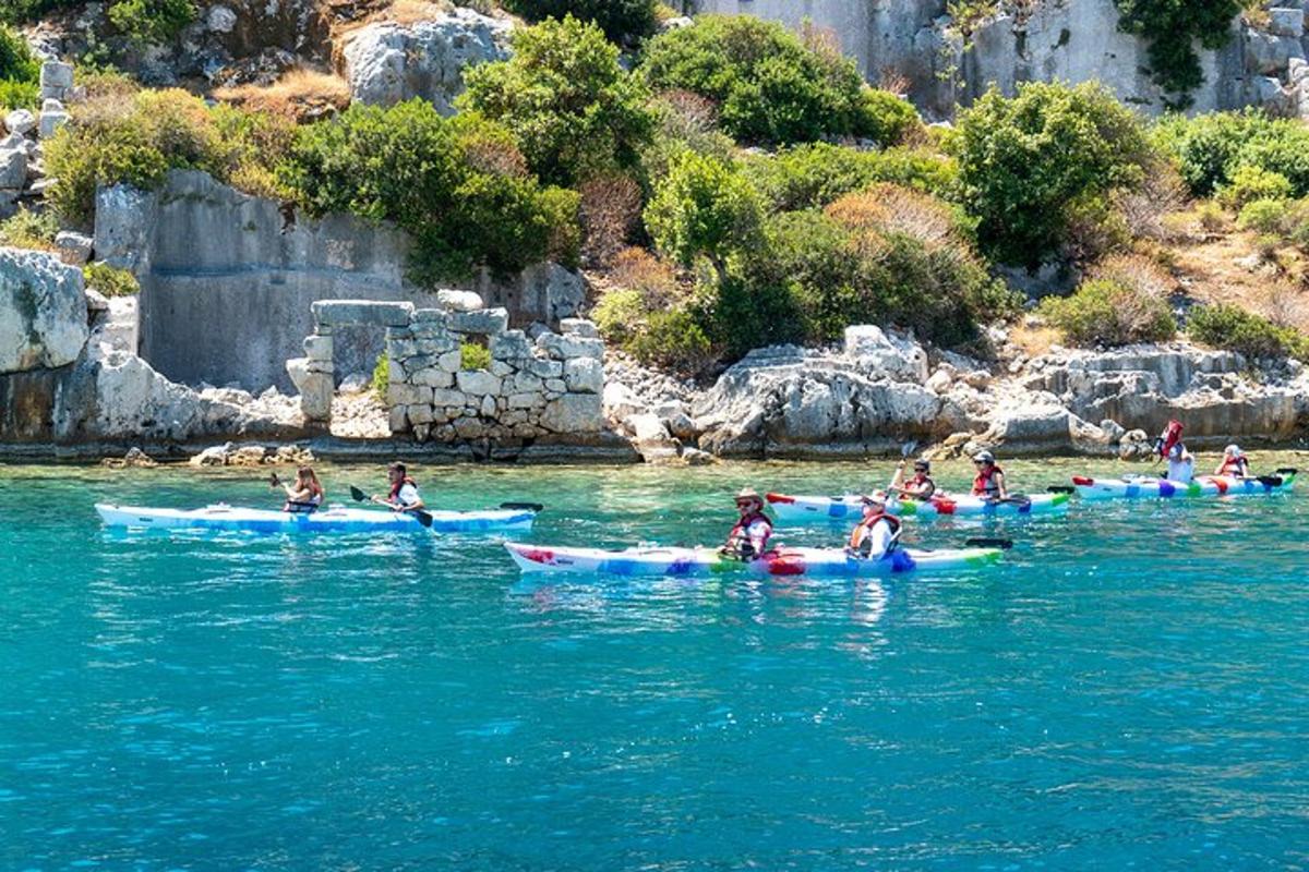 a group of people on kayaks in the water