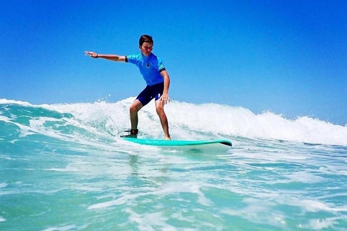 a man riding a wave on a surfboard in the ocean