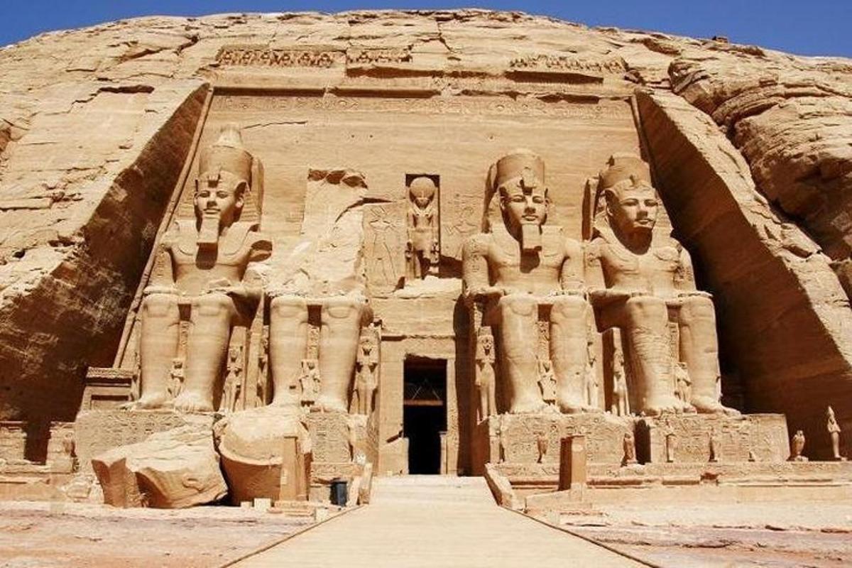 a large building with statues on the side of it