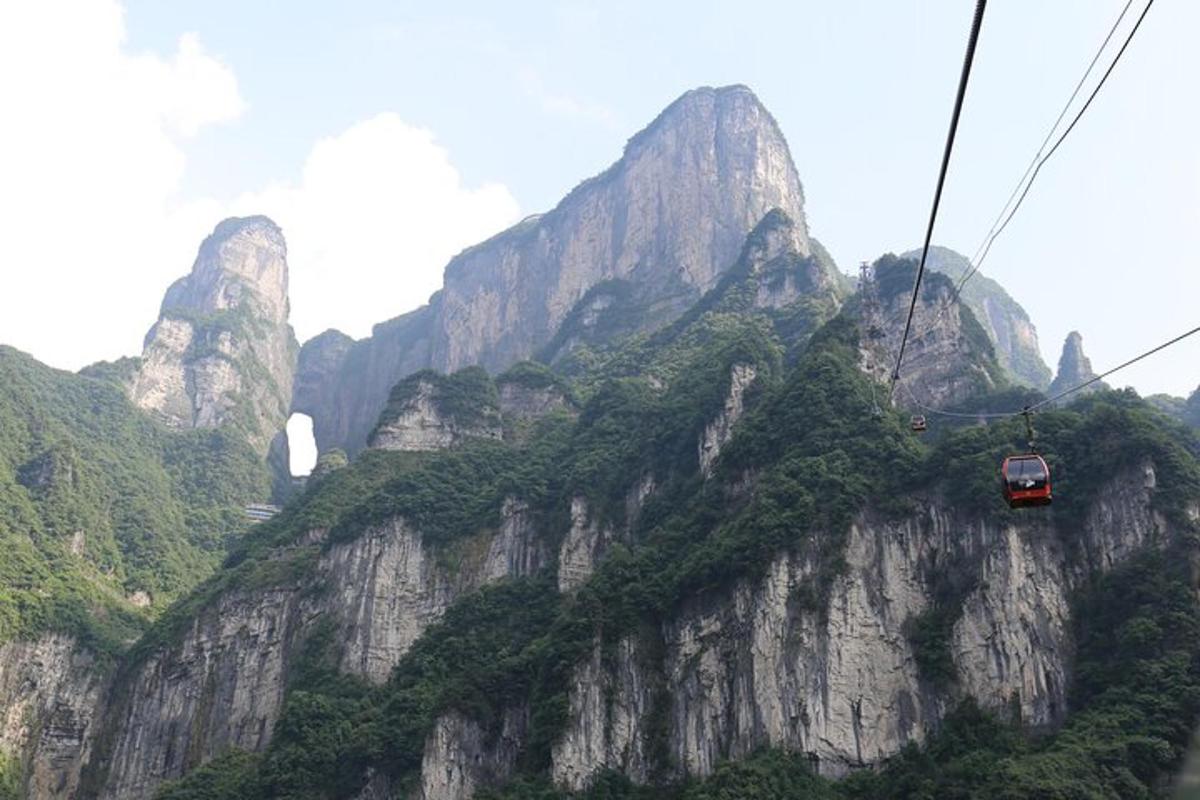 a mountain with a car on a ski lift