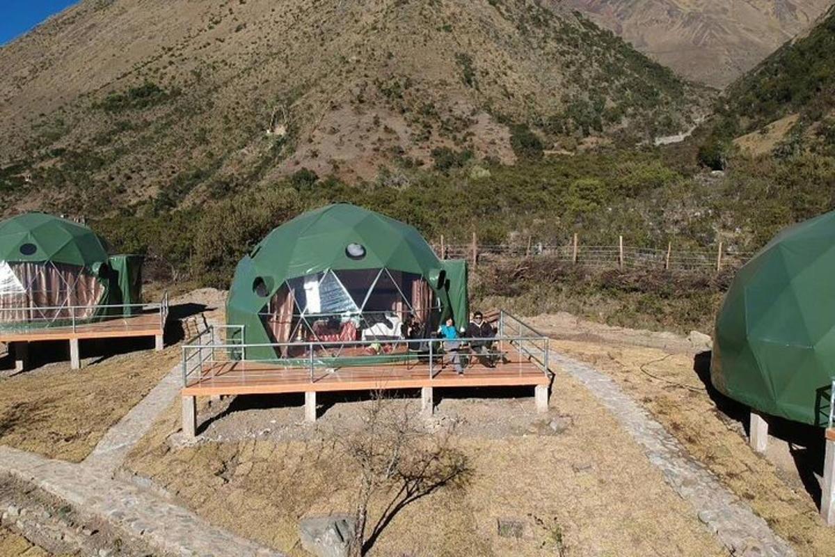 a group of tents on top of a mountain