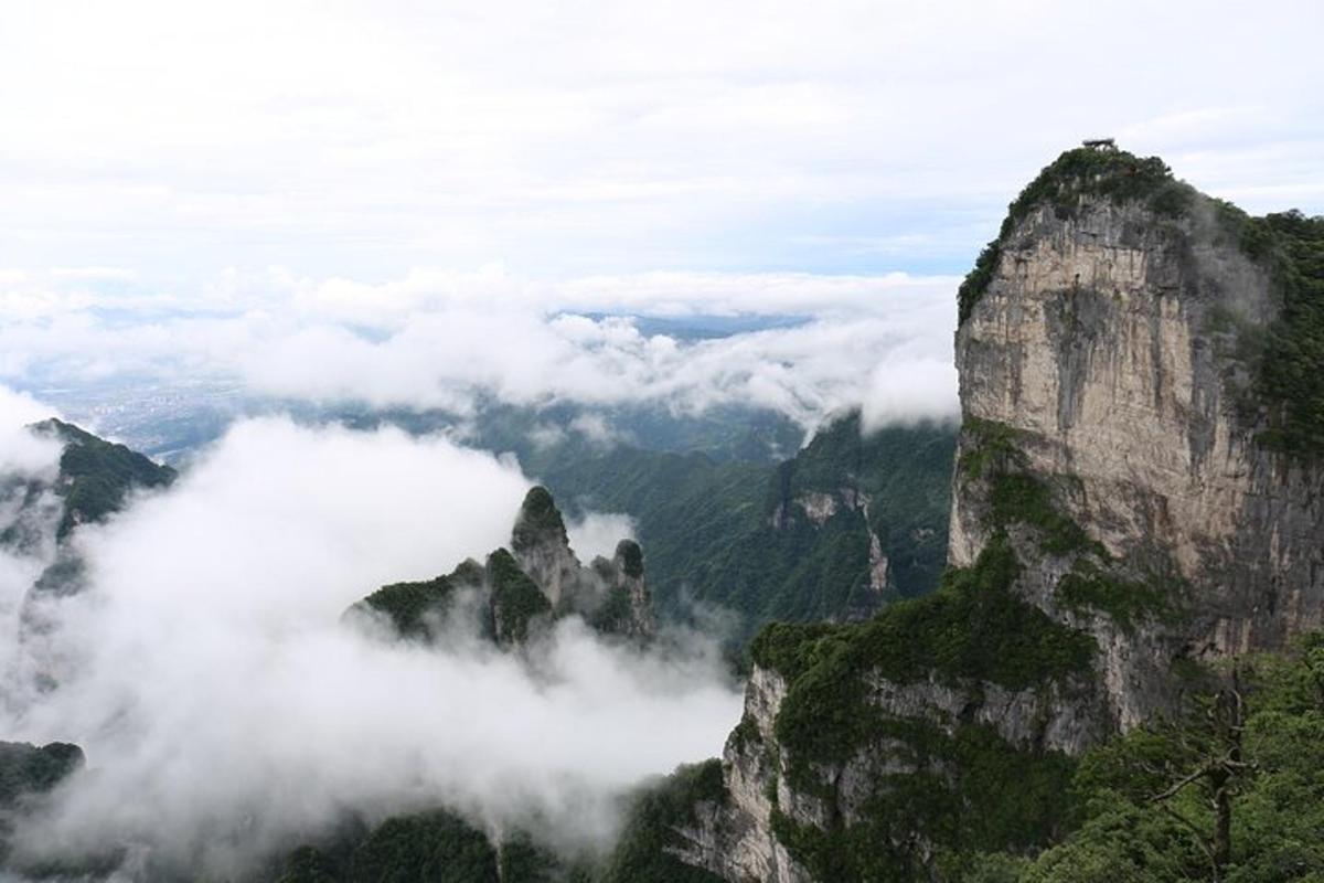 a view of a mountain range with clouds