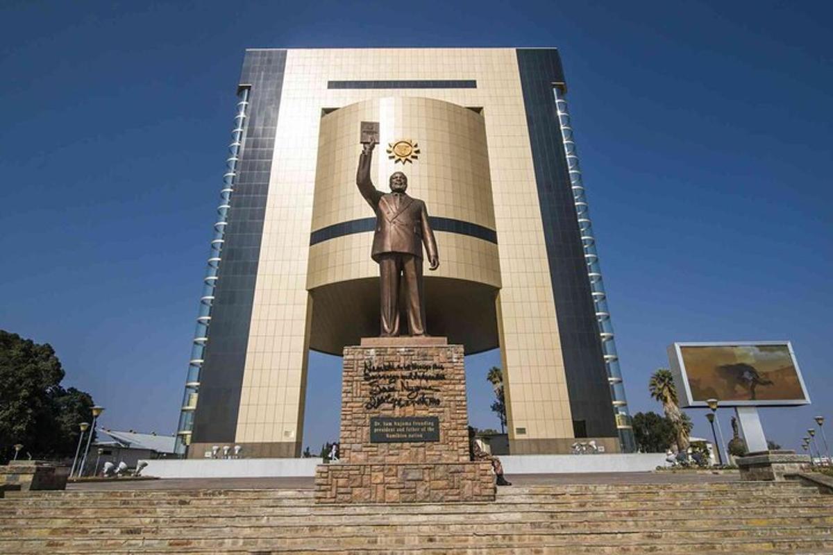 a statue of a man in front of a building