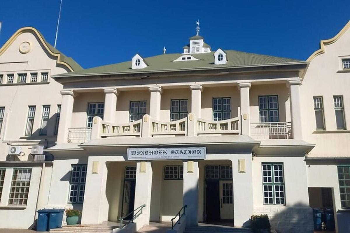 a white building with a balcony on top of it