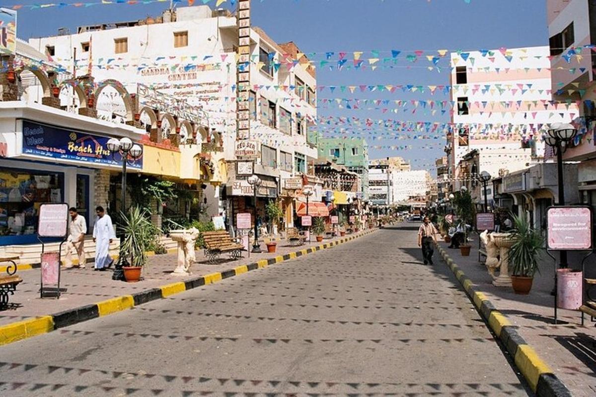 a city street with buildings and people walking on the street