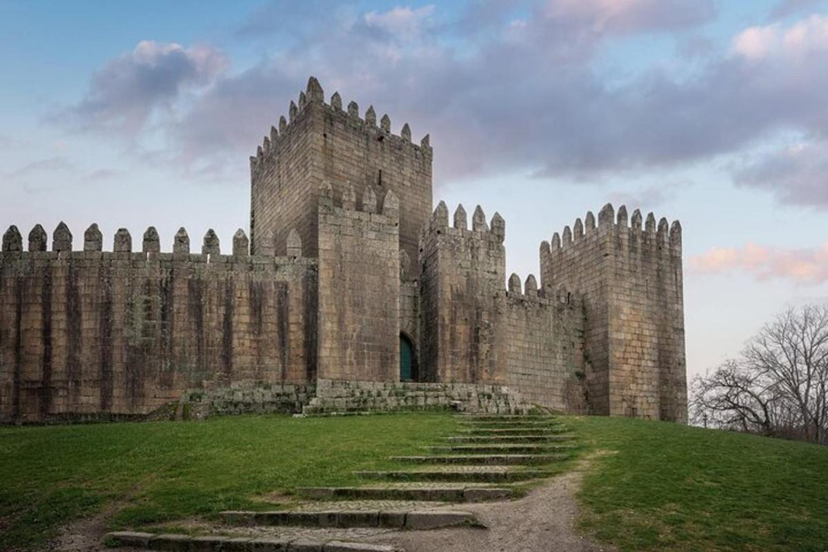 a large stone castle with stairs in front of it