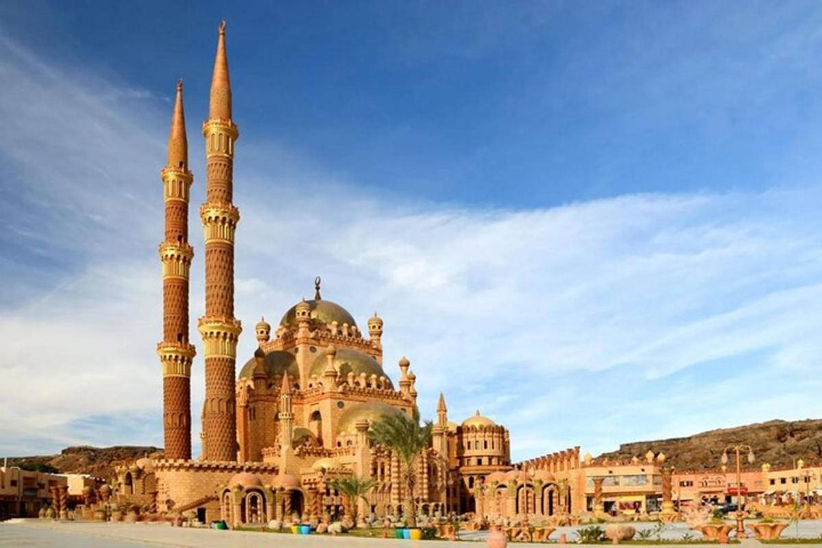 a building with a mosque with two tall towers